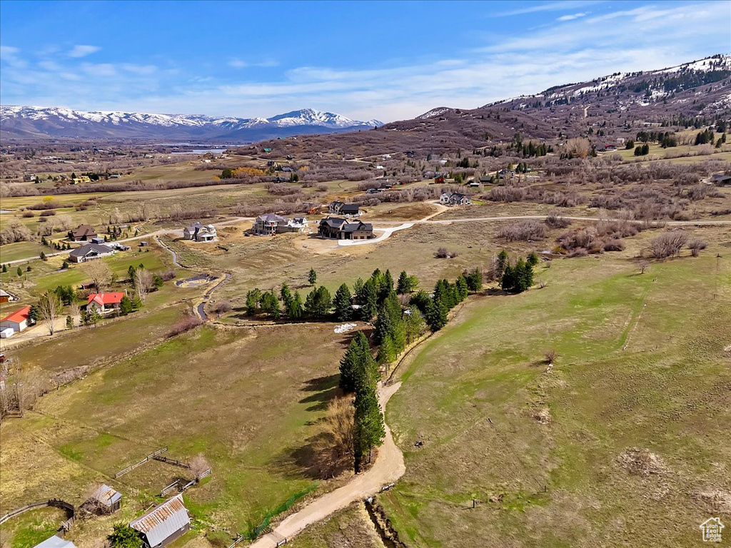 Birds eye view of property featuring a mountain view