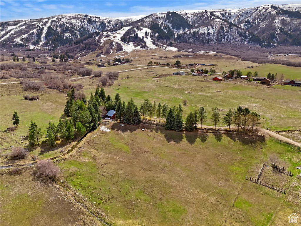 Birds eye view of property with a mountain view and a rural view