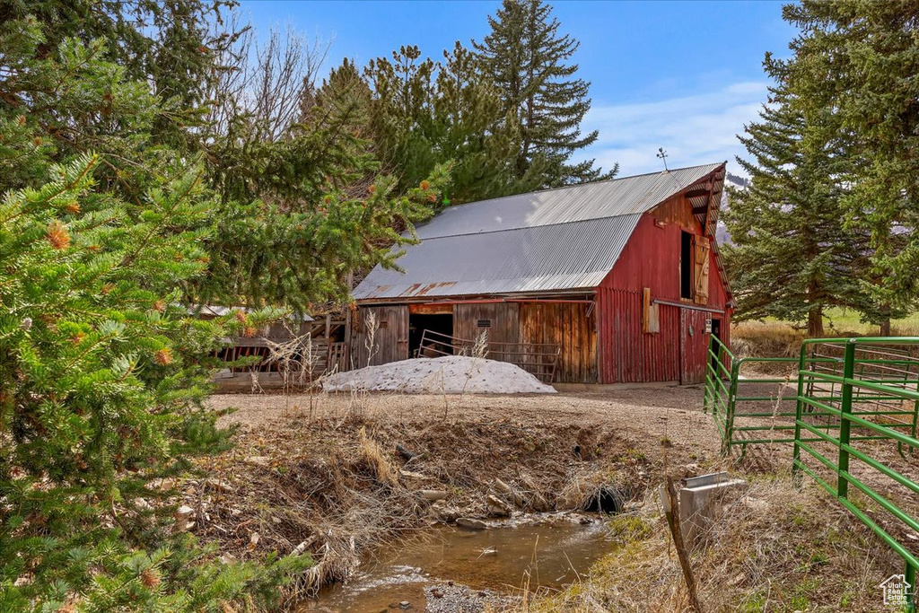 View of barn with fence
