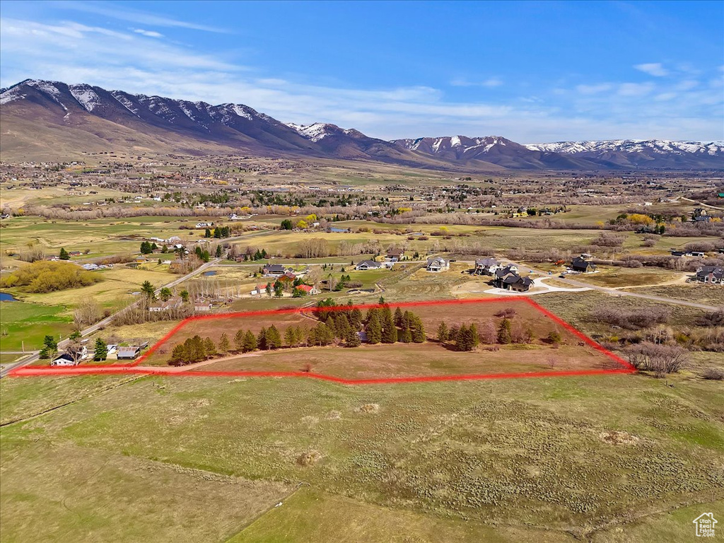 Birds eye view of property with a mountain view