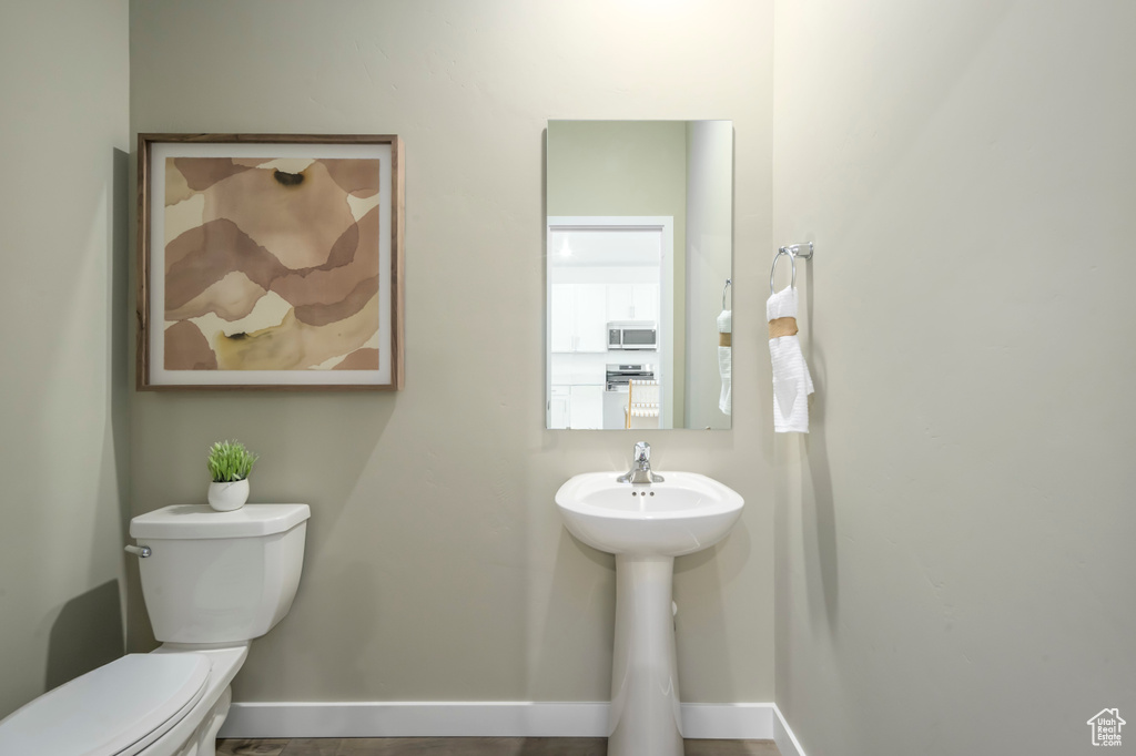 Bathroom with baseboards and toilet