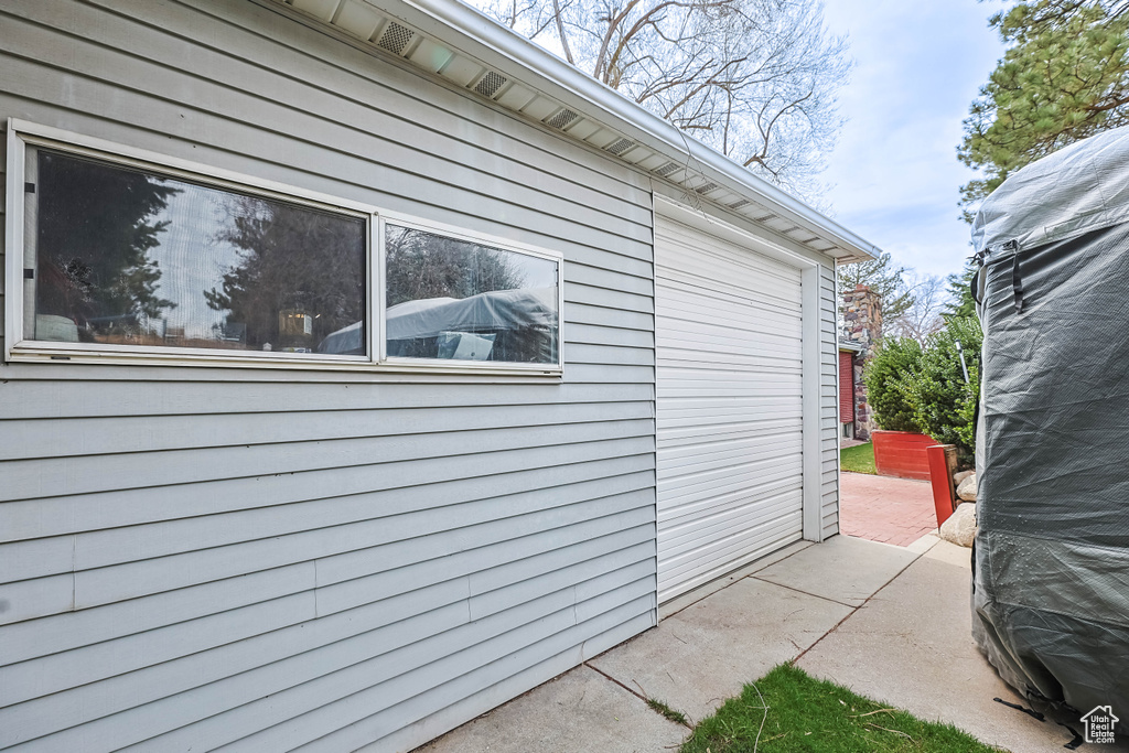 View of side of property featuring a patio area