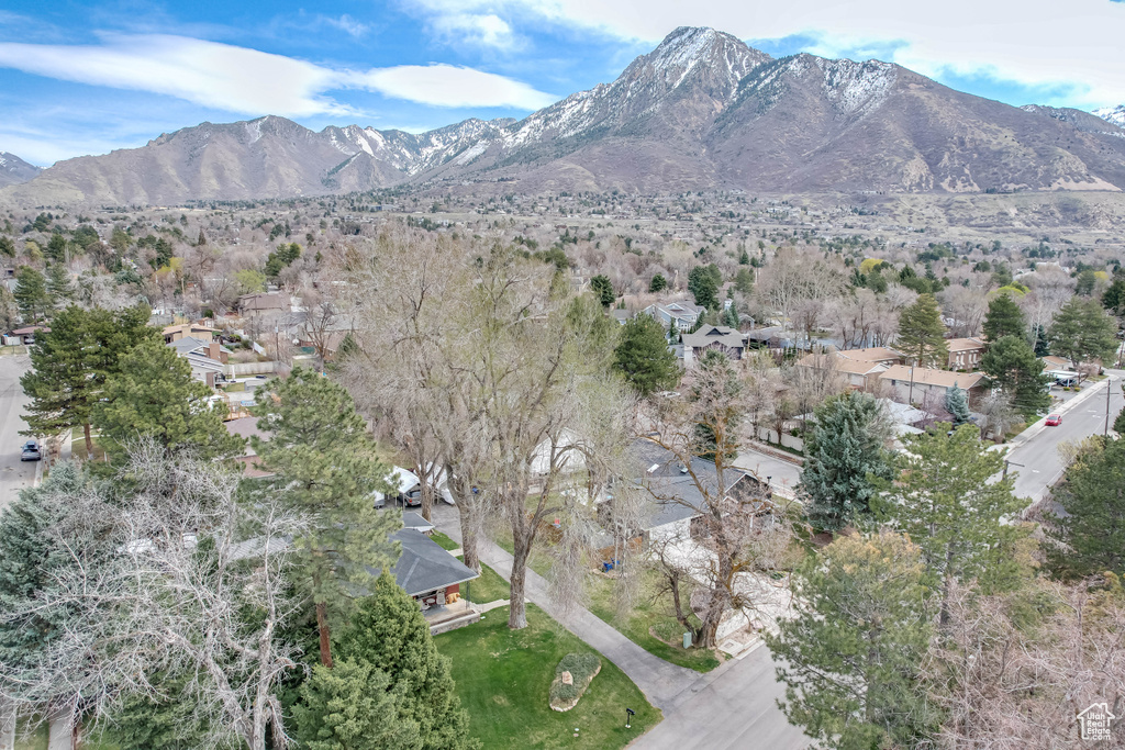 Property view of mountains with a residential view