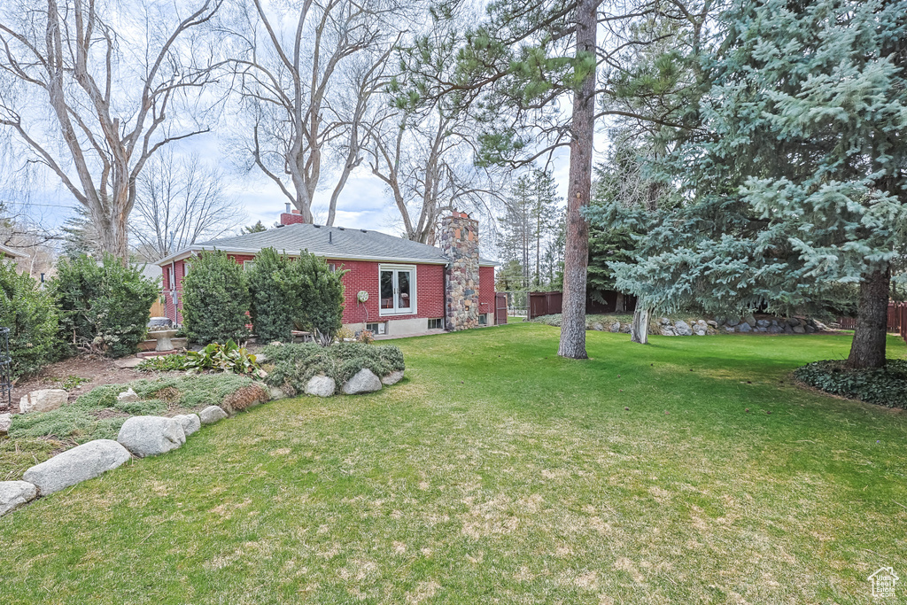 View of yard with fence