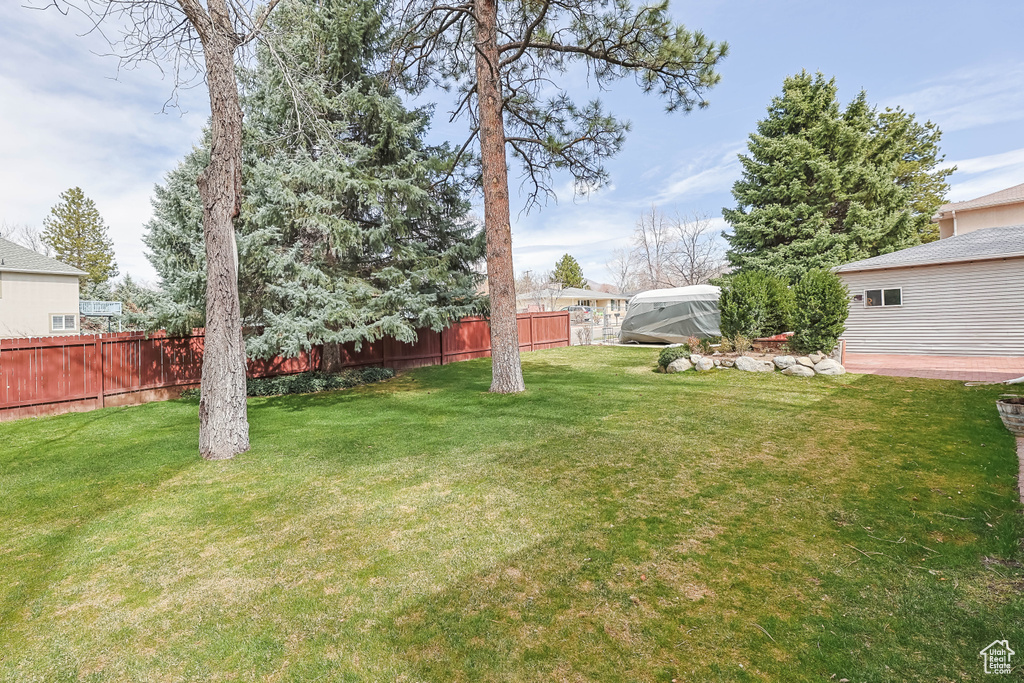 View of yard featuring fence