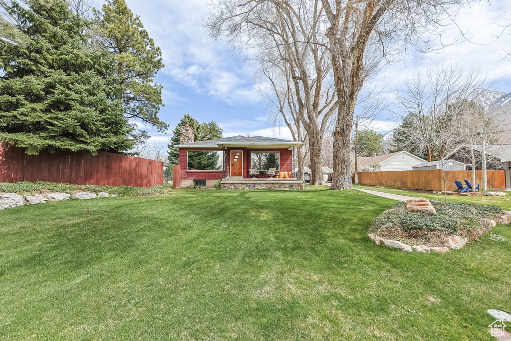 View of yard featuring fence