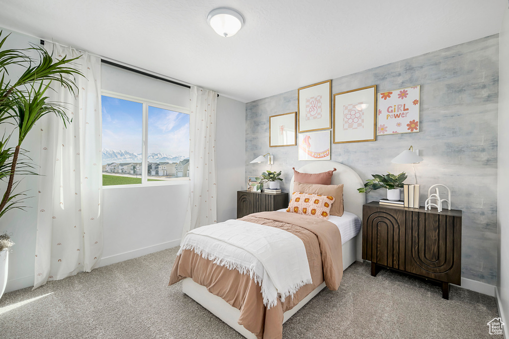 Bedroom with carpet and baseboards