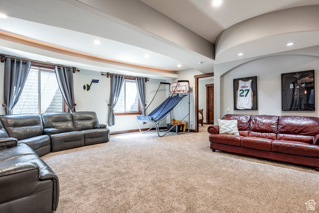 Carpeted living room with baseboards and recessed lighting