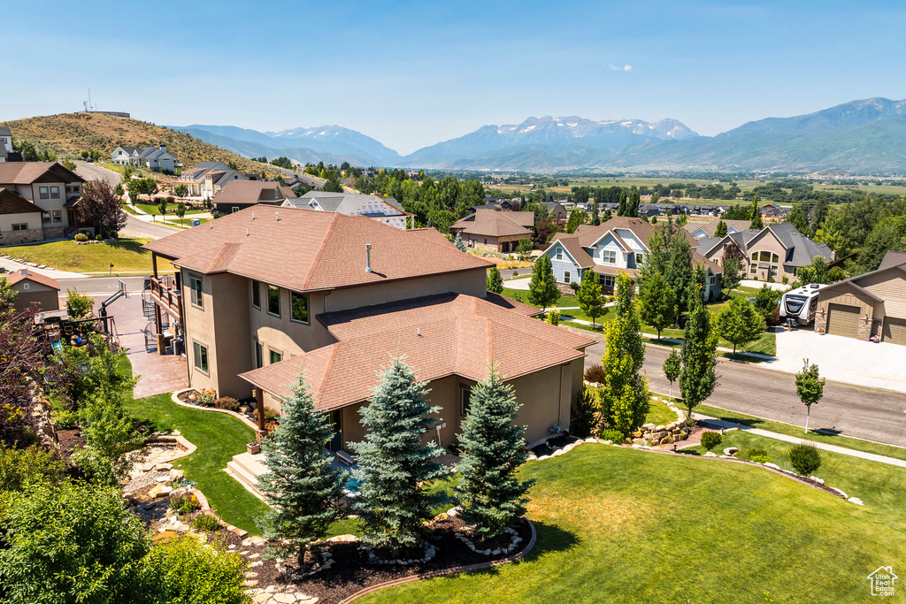 Drone / aerial view with a residential view and a mountain view