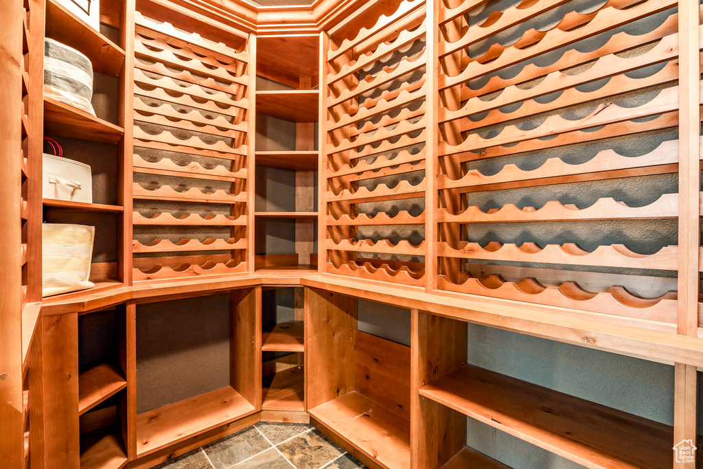 Wine room with a sauna and stone finish floor