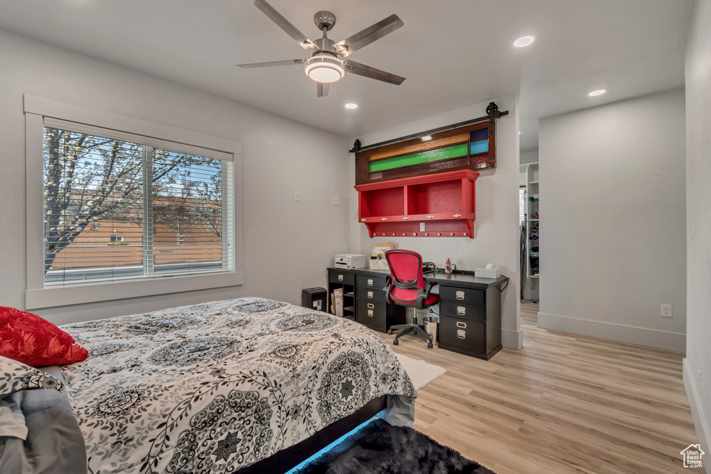 Bedroom featuring recessed lighting, baseboards, a ceiling fan, and wood finished floors