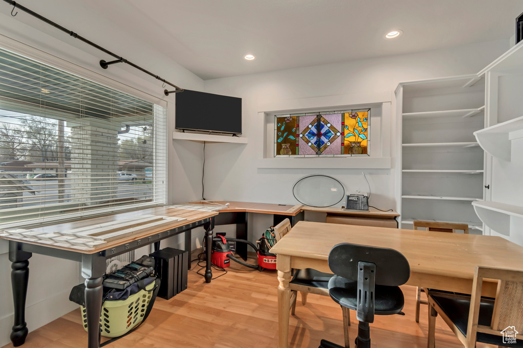 Home office featuring light wood-style flooring and recessed lighting