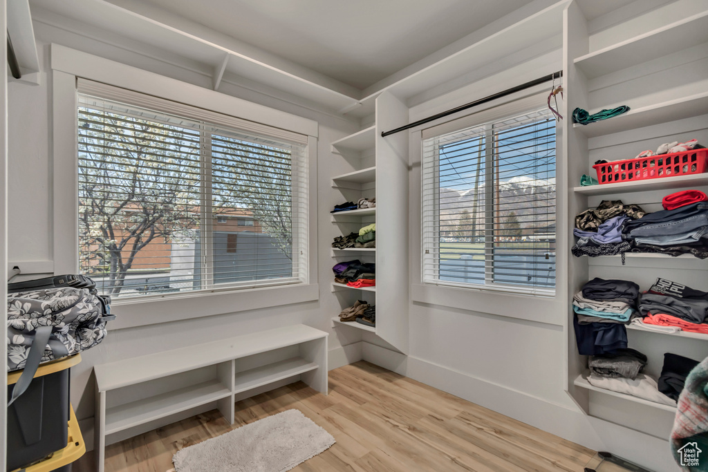 Walk in closet featuring light wood-style floors