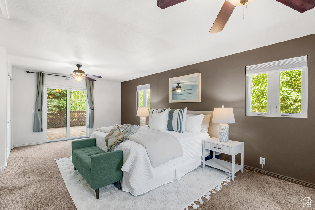 Bedroom featuring access to outside, ceiling fan, and light colored carpet