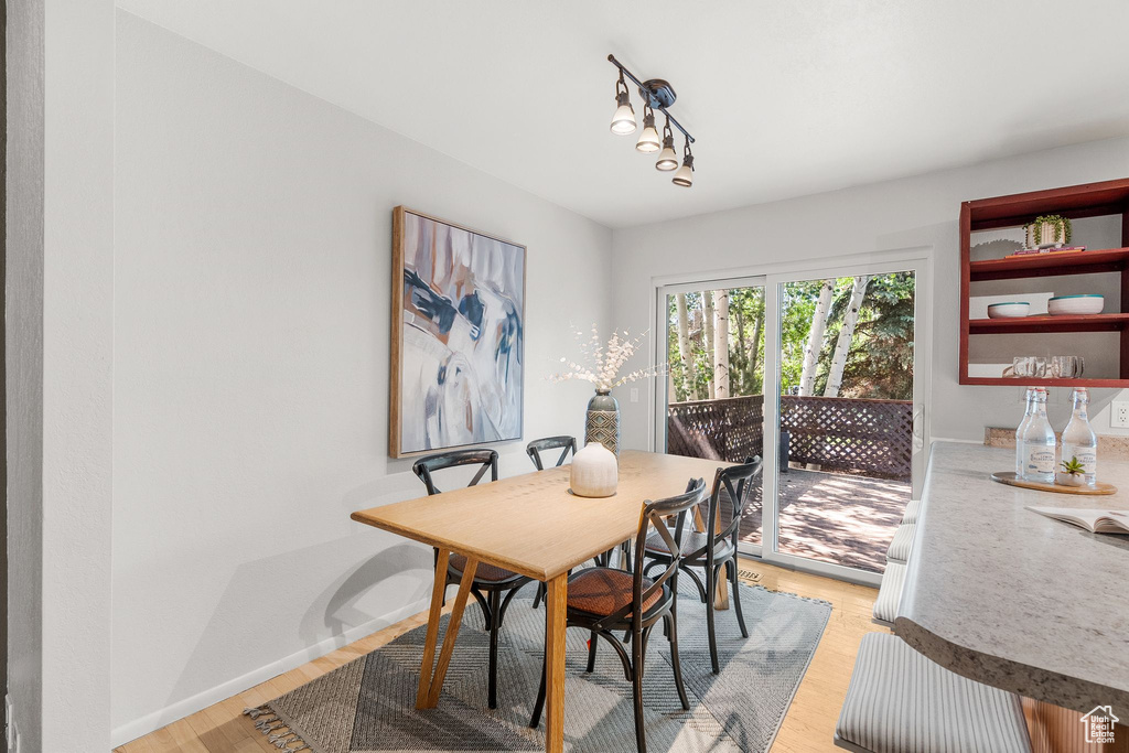 Dining space with light wood finished floors