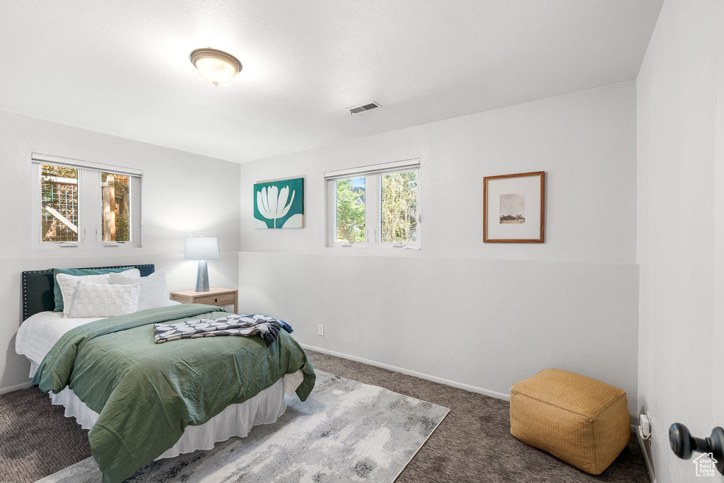 Bedroom with carpet and baseboards