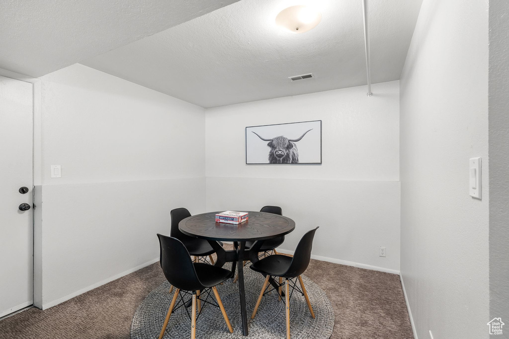 Dining room featuring carpet flooring