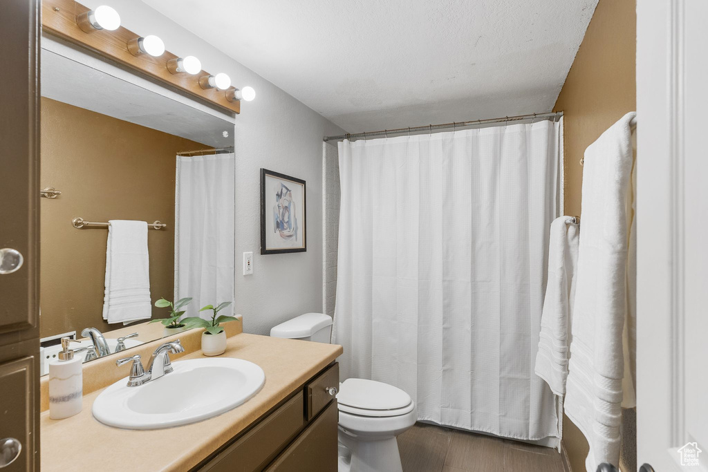 Bathroom with vanity and wood finished floors