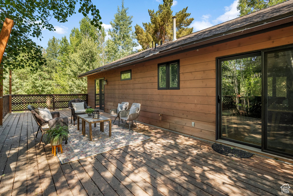 Wooden terrace with an outdoor living space