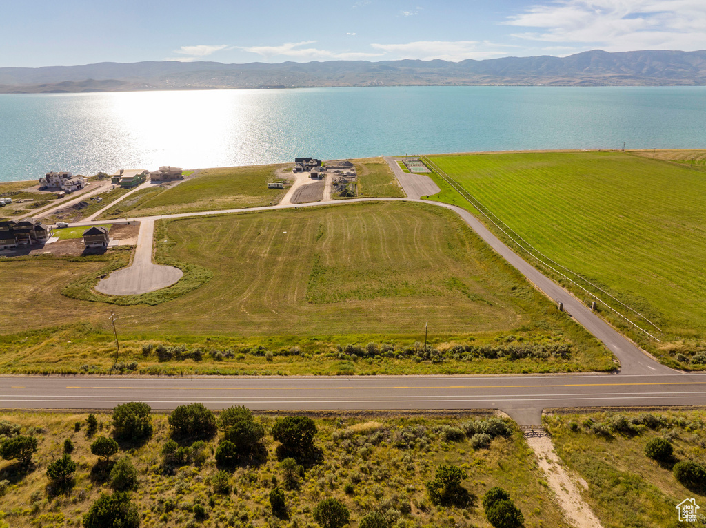 Birds eye view of property with a rural view and a water and mountain view