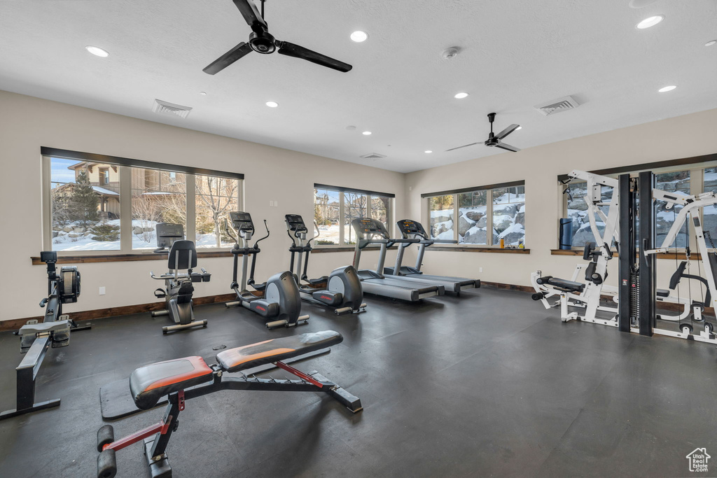 Workout area with a ceiling fan, recessed lighting, and baseboards