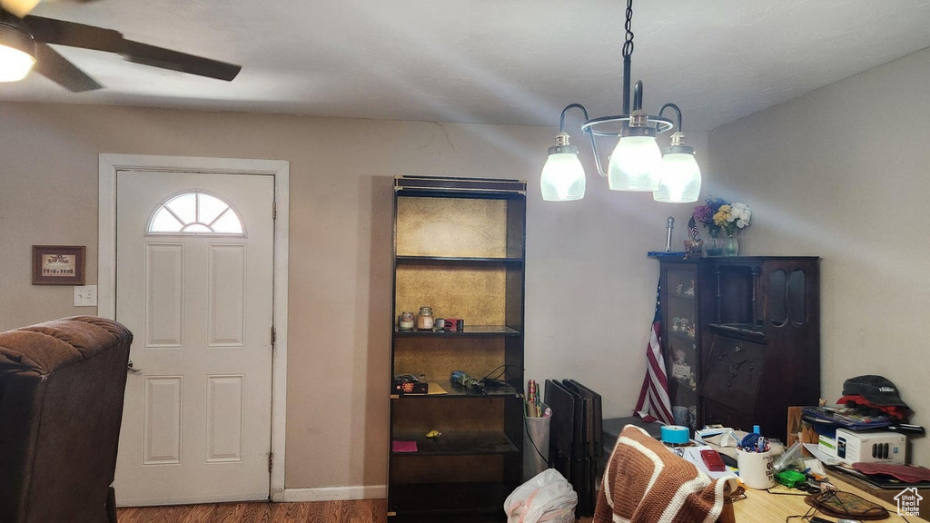 Entrance foyer featuring a ceiling fan and wood finished floors