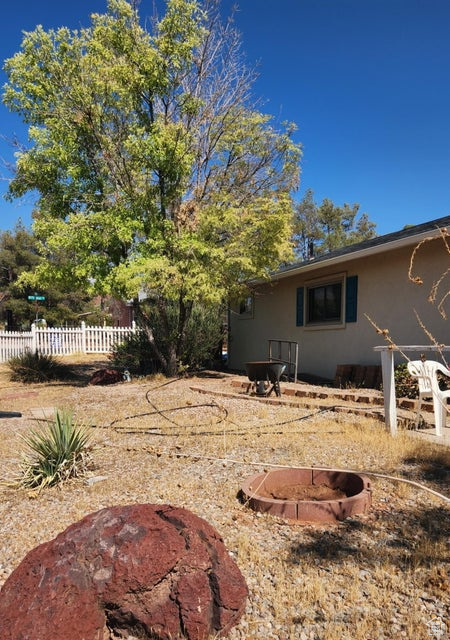 View of yard with a fire pit