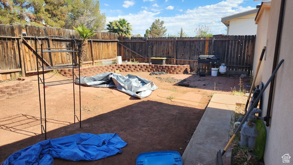 View of fenced backyard