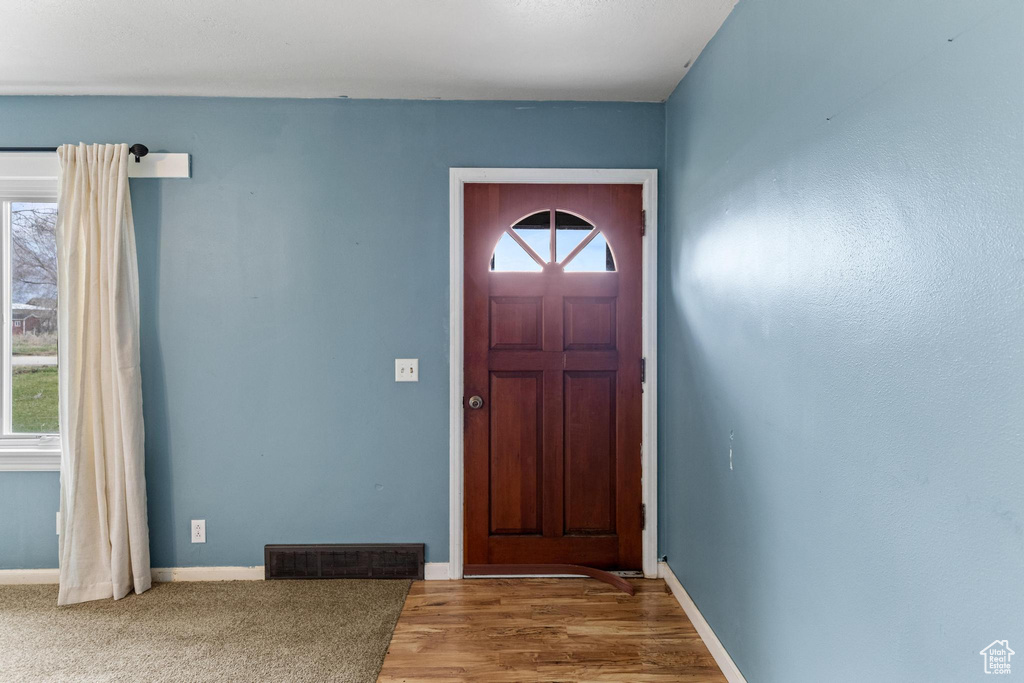 Entryway with plenty of natural light, baseboards, and visible vents