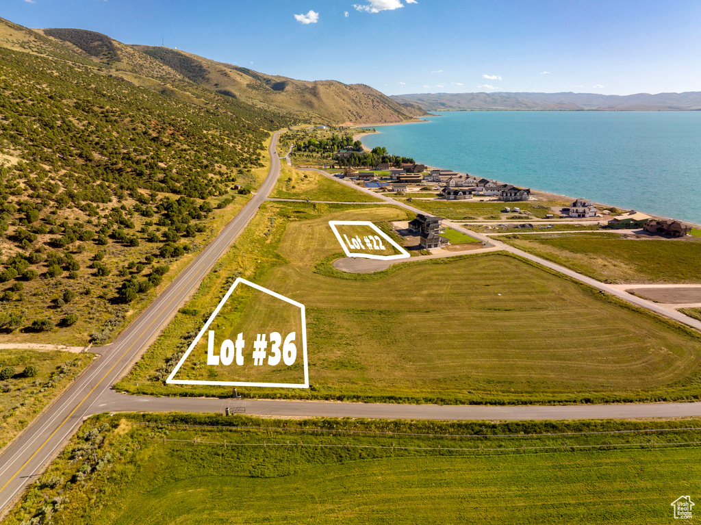 Aerial view featuring a water and mountain view