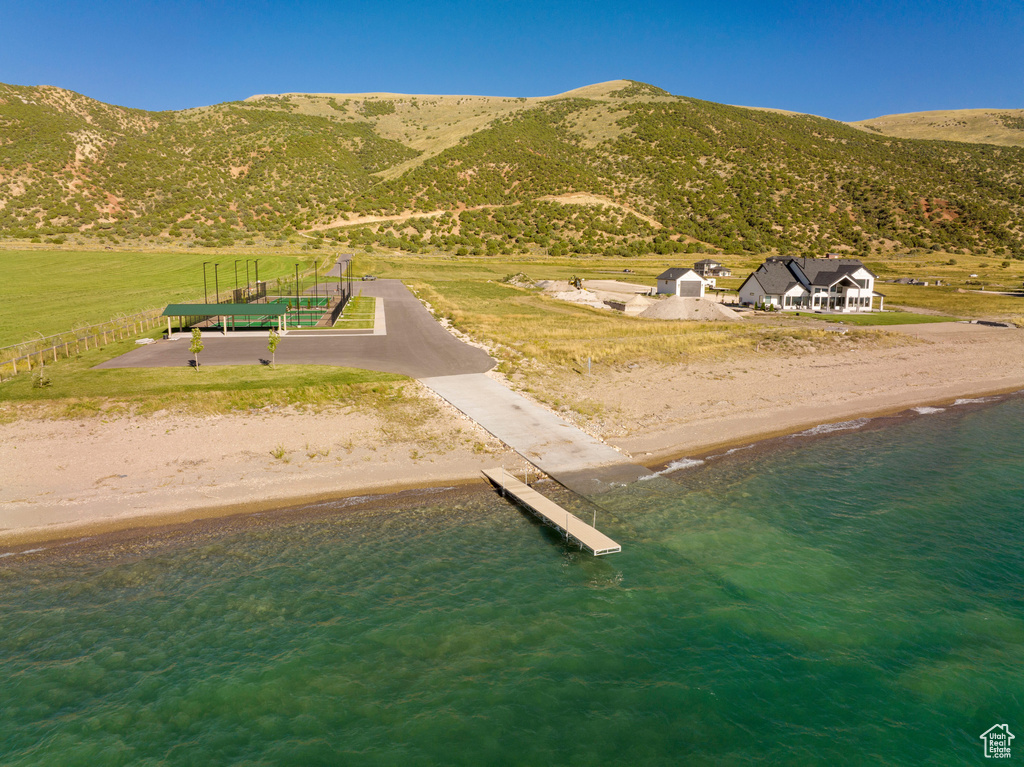 Exterior space with a water and mountain view
