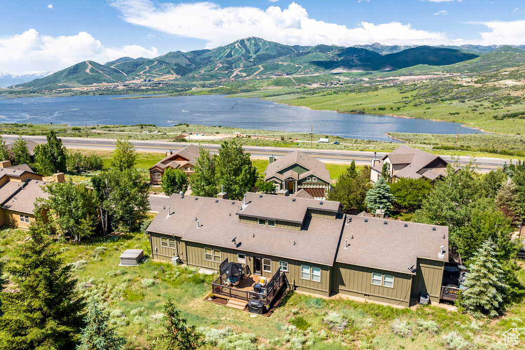 View of subject property featuring a water and mountain view