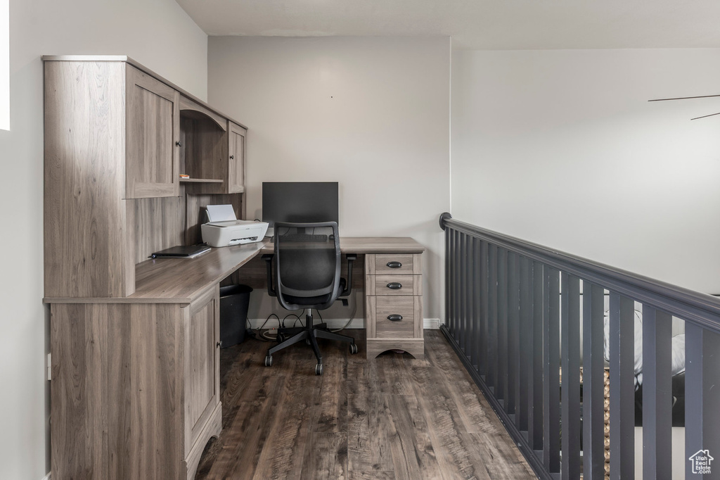 Office area featuring dark wood-style flooring