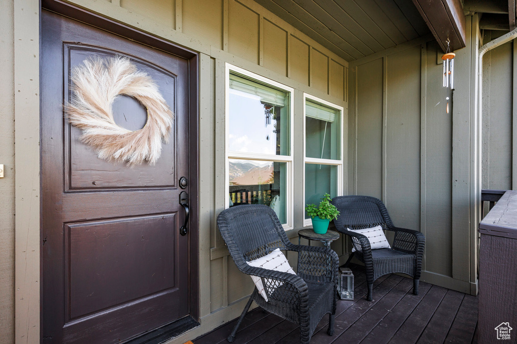 Property entrance featuring board and batten siding