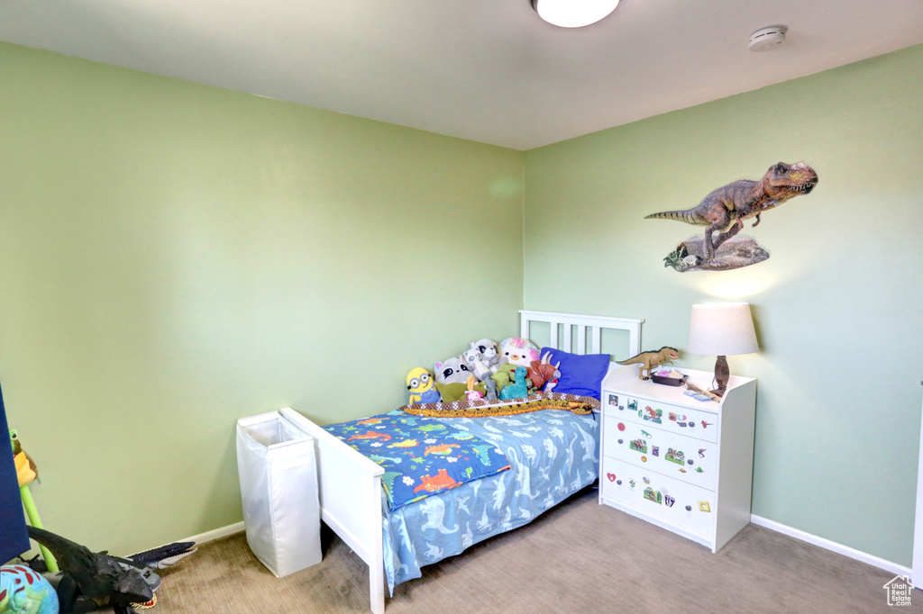 Carpeted bedroom featuring baseboards