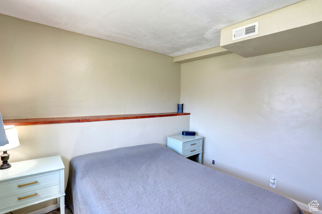 Bedroom featuring visible vents