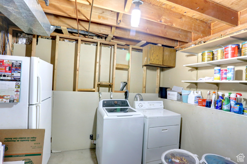 Laundry room with washing machine and clothes dryer and laundry area