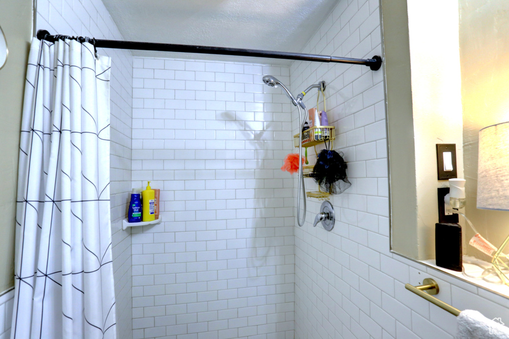 Bathroom with tiled shower