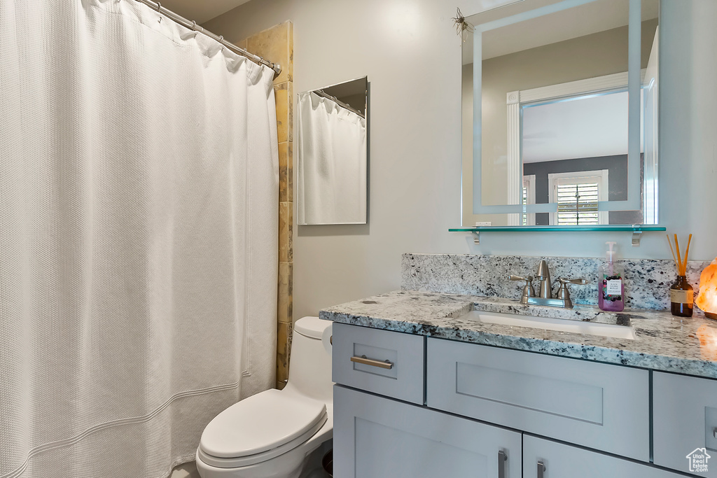 Bathroom with toilet and vanity