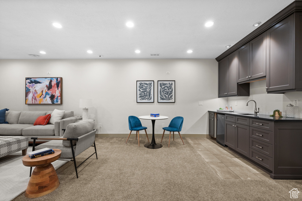 Living area with light carpet, baseboards, visible vents, and recessed lighting