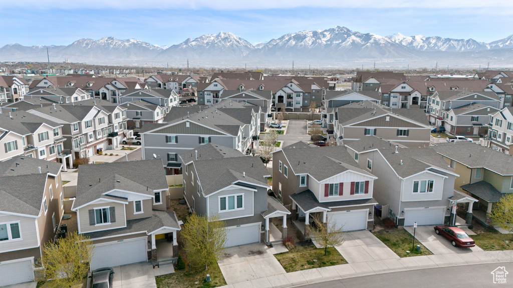 Drone / aerial view with a residential view and a mountain view
