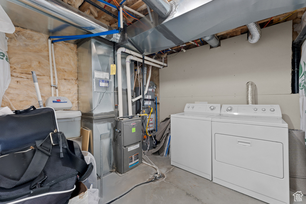 Unfinished below grade area with independent washer and dryer