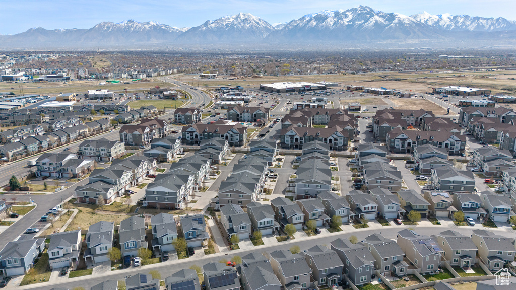 Birds eye view of property with a mountain view and a residential view