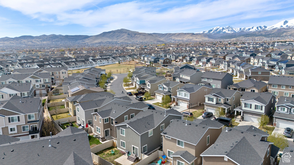 Birds eye view of property with a residential view and a mountain view