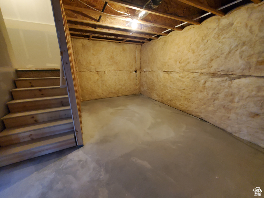Unfinished basement with stairway