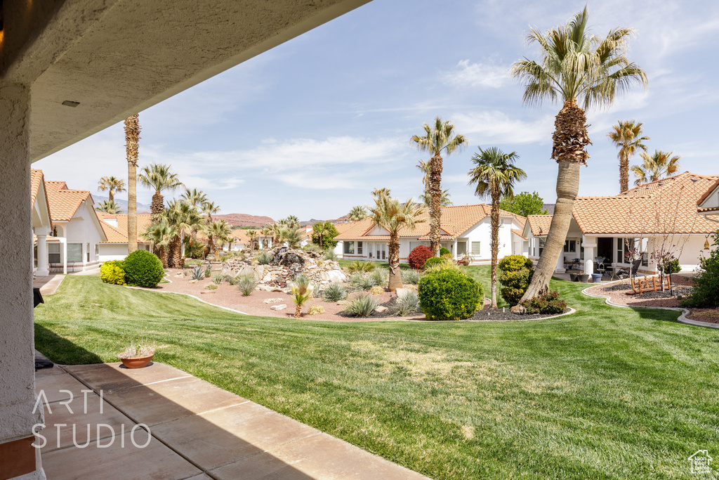 View of yard featuring a residential view and a patio