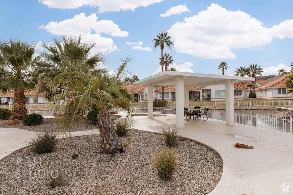 Exterior space with a patio area and fence
