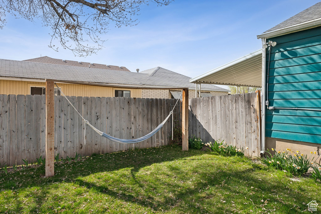View of yard featuring fence