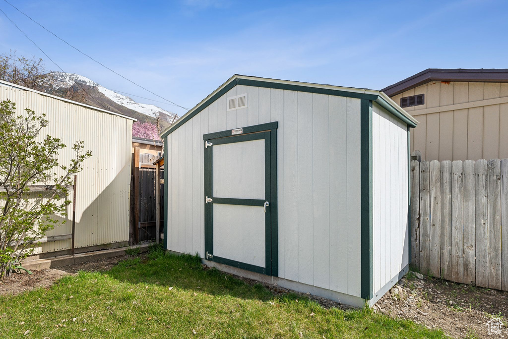 View of shed featuring a fenced backyard