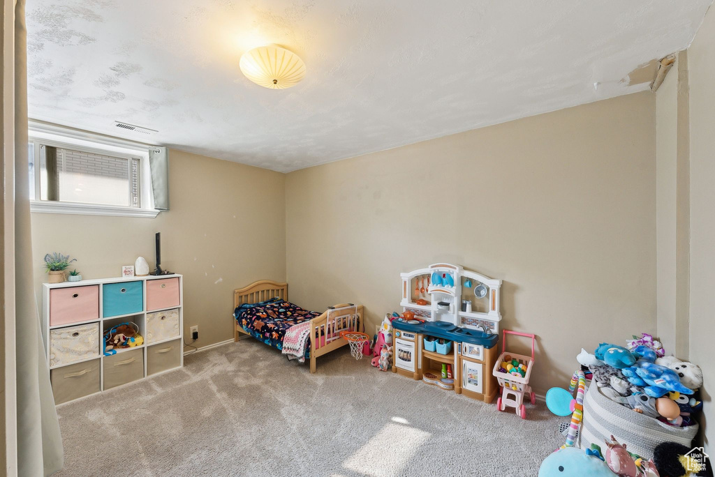 Carpeted bedroom with visible vents